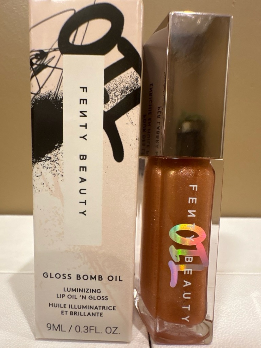 Fenty Beauty Gloss Bomb Oil — Shimmery Bronze Peach